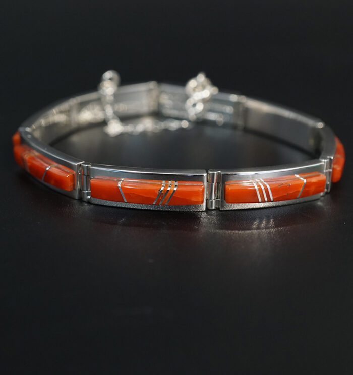 Sterling silver link bracelet with natural coral inlay