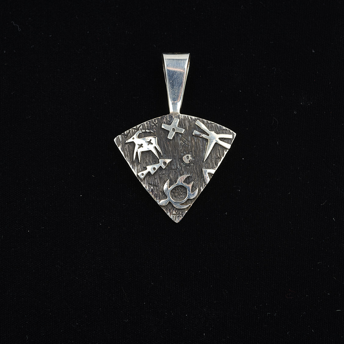 Double-sided triangular sterling silver pendant